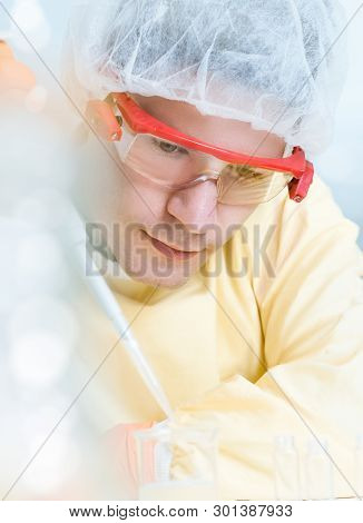 Portrait Of A Young Male Scientist With Automatic Pipette, Shallow Dof, Focus On Front Eye