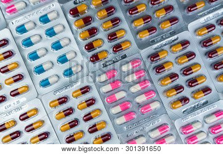 Top View Of Colorful Antibiotic Capsule Pills In Blister Pack. Antibiotic Drug Resistance. Pharmaceu
