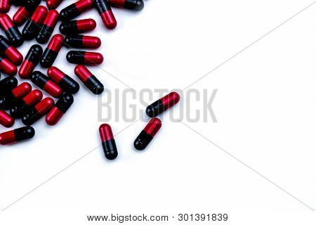 Red-black Capsule Pills Isolated On White Background With Space For Text. Pharmaceutics Concept. Pha