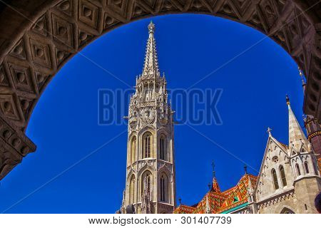 Budapest/hungary- May 7, 2018: View Of Beautiful Saint Mathias Church White Gothic Tower Over Blue S