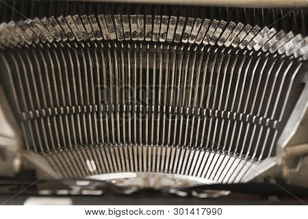 Close Up Of Typebars On An Old Typewriter