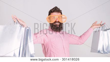 Man Bearded Hipster With Lot Shopping Bags. Shopping On Black Friday. Happy Shopping With Bunch Pape