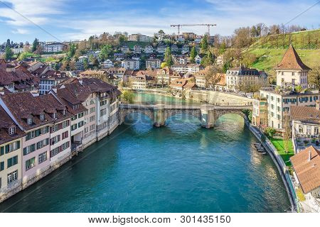Bern, Switzerland. View Of The Old City Center And Nydeggbrucke Bridge Over River Aare.
