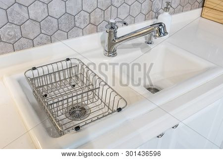 White Kitchen Sink And Faucet , The Interior Of The Kitchen Room Of The Apartment. Built-in Applianc