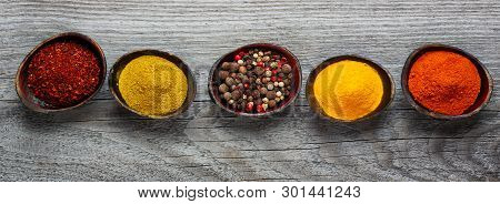 Wooden Table Of Colorful Spices. Top View
