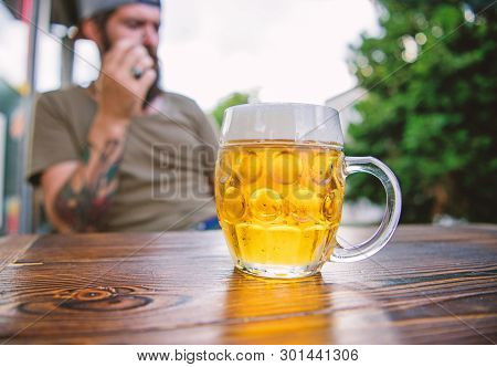 Relaxing With A Drink In The Comfortable Bar. Refreshing Drink On Cafe Table. Hipster Enjoying Beer 