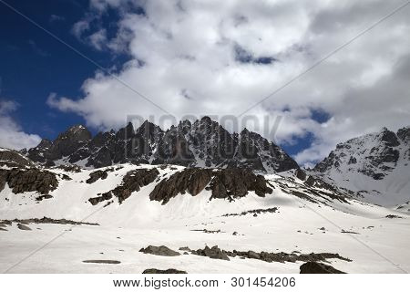 High Sunlit Rocks, Snowy Plateau With Stones And Cloudy Blue Sky In Sunny Winter Day. Turkey, Kachka