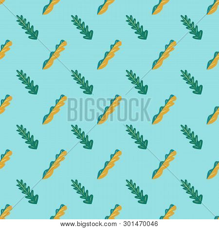 Seamless Pattern Of Fun Green And Yellow Leaves On A Bright Blue Background.