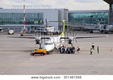 The Plane Goes To The Airport. Air Transport. Transportation Of People. . Airbaltic Airplane. Russia