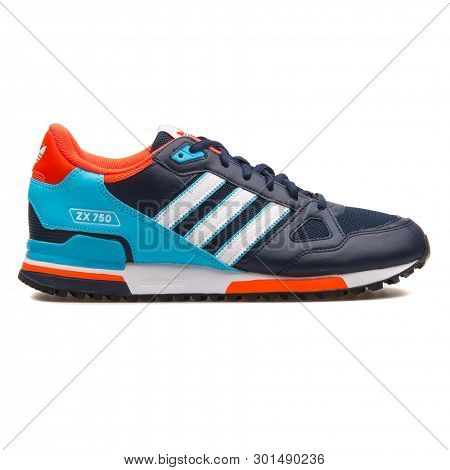 Vienna, Austria - August 10, 2017: Adidas Zx 750 Navy Blue, Crimson And Cyan Sneaker On White Backgr