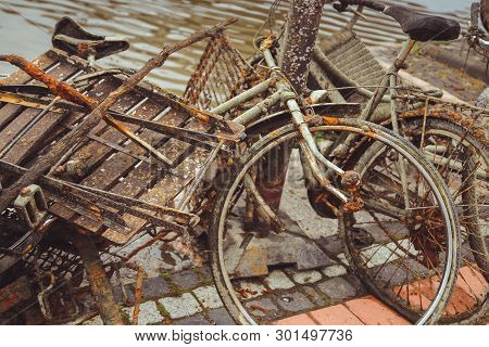 Porvoo, Finland - May 2019: Old Rusty Bicycles Abandoned On The River Bank In The Finnish City Of Po