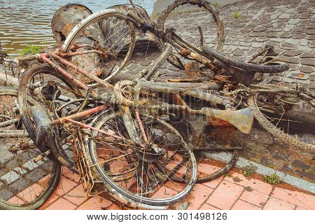 Porvoo, Finland - May 2019: Old Rusty Bicycles Abandoned On The River Bank In The Finnish City Of Po