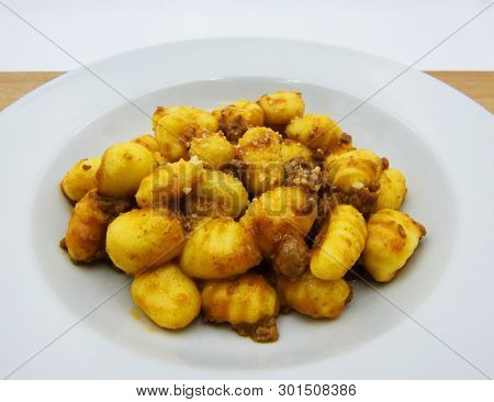 Homemade Potato Gnocchi With Bolognese Sauce (ragu) On A White Plate