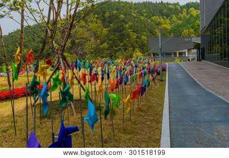 Muju,south Korea; May 1, 2019: Rows Of Colorful Pinwheels In Lawn In Front Of National Taekwondo Mus