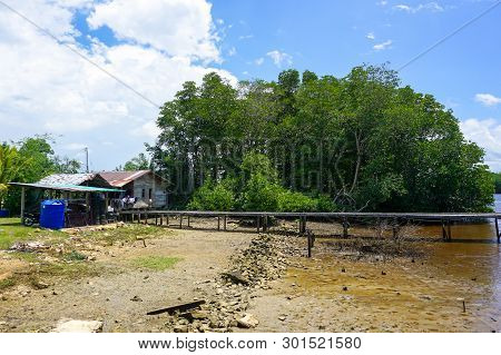 House On The River Shore With Jetty For Mooring Fishing Boats In Kuala Penyu,sabah Borneo,malaysia.k