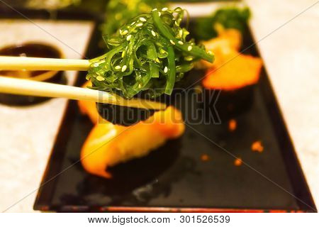Catch Chopsticks, Salad, Seaweed Bowl In Japanese Food Style In Japanese Restaurants, Vegetables On 