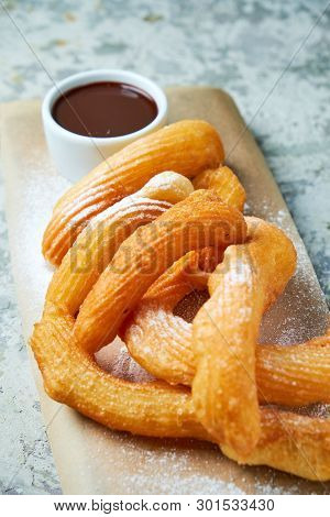 Churos Spanish Dessert. Gray Textured Background. Beautiful Serving Dishes. Dessert. Food Chain