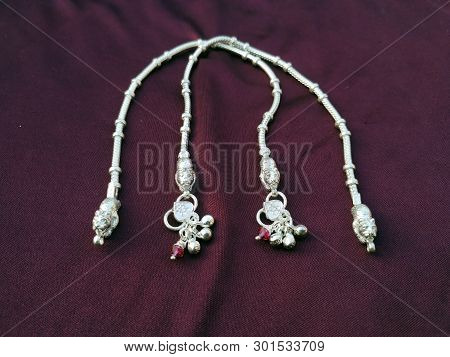 Indian Traditional Leg Wear Jewelry Payal Or Kandora On Violet Background
