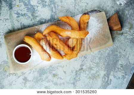 Churos Spanish Dessert. Gray Textured Background. Beautiful Serving Dishes. Dessert. Food Chain