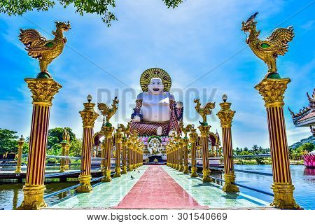 Statue Of Budai In Buddhist Temple Wat Plai Leam On Samui Island, Thailand