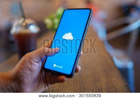 Chiang Mai, Thailand - Mar. 24,2019: Man Holding Xiaomi Mi Mix 3 With Onedrive On Screen. Microsoft 