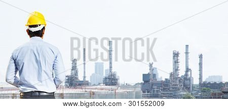 Male Engineer Is Working At The Refinery.