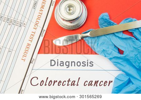 Surgical Diagnosis Of Colorectal Cancer. Surgical Medical Instrument Scalpel, Latex Gloves, Blood Te