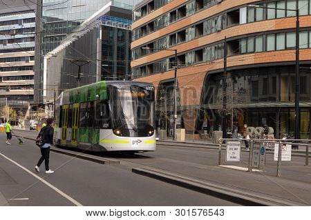 Docklands, Australia - September 25th 2018: Tram Riding Down Collins Street, Docklands, Towards Vict