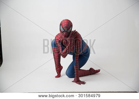 Central, Hong Kong - May 19, 2019: Man In Superhero Costume Comic Marvel Spider On Gray Background