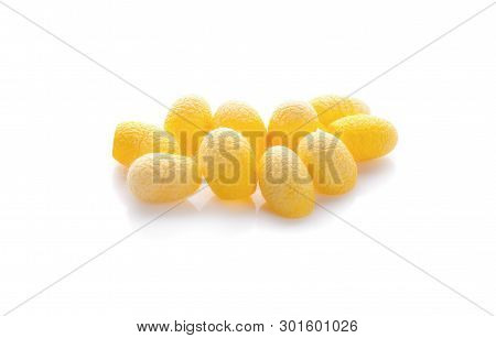 Yellow Thai Silkworm Cocoons Pile Isolated On White Background.
