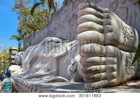 Tourists Are Beside Lying Buddha With Symbol Solstice In Pagoda In Nha Trang