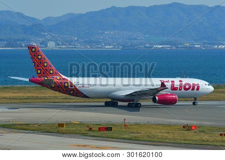 Passenger Airplane Taxiing On Runway