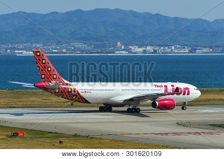 Passenger Airplane Taxiing On Runway