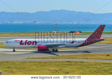 Passenger Airplane Taxiing On Runway