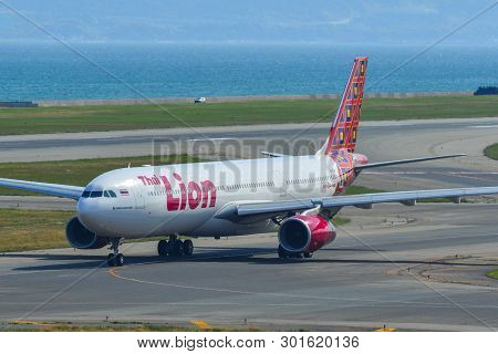 Passenger Airplane Taxiing On Runway