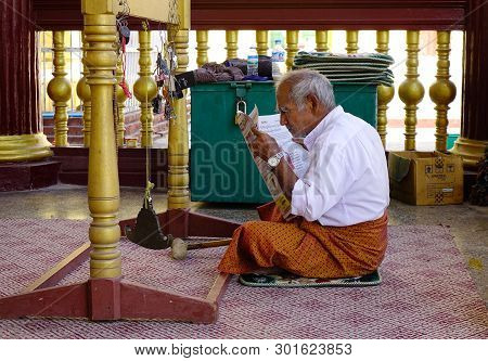 An Old Man Reading News On The Morning