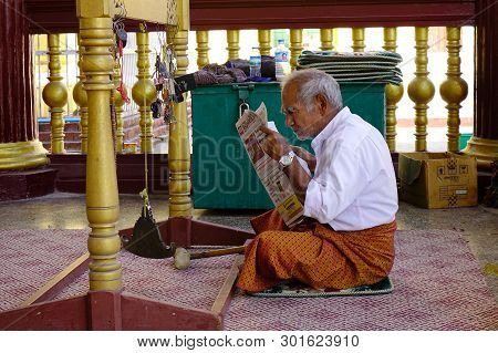 An Old Man Reading News On The Morning