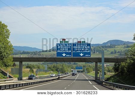 Traffic Sign On The Highway In France With Names Of Many French And Italian City