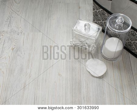 Cosmetic Flatlay On Grey Wooden Table. Beauty Set Of Box, Plastic Containers With Q-tips And Disks. 