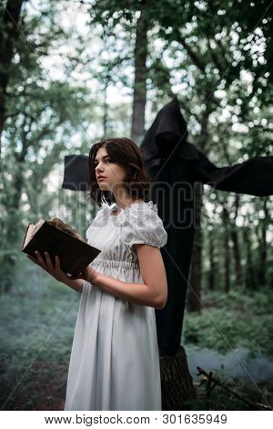 Victim in rags and death in the forest, exorcism