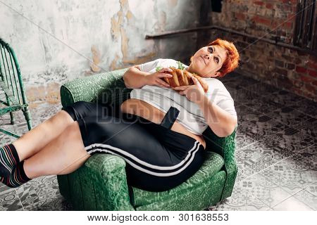 Overweight woman with sandwich, bulimic, obesity