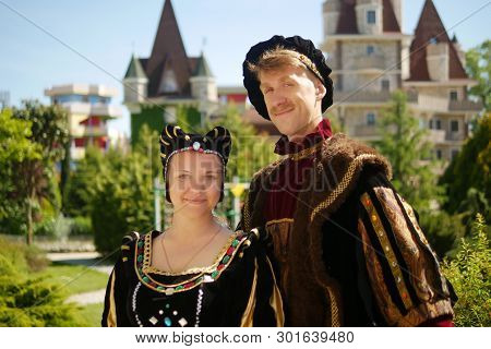 Couple, Duke And Duchess Against The Backdrop Of The Castle In A Beautiful Park