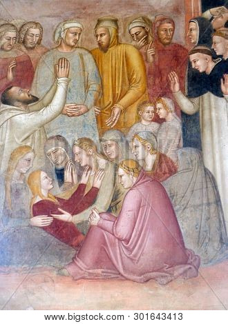 FLORENCE, ITALY - JANUARY 10, 2019: Miracle of the saint, detail from St Peter of Verona preaching, fresco by Andrea di Bonaiuto, Spanish Chapel in Santa Maria Novella Dominican church in Florence