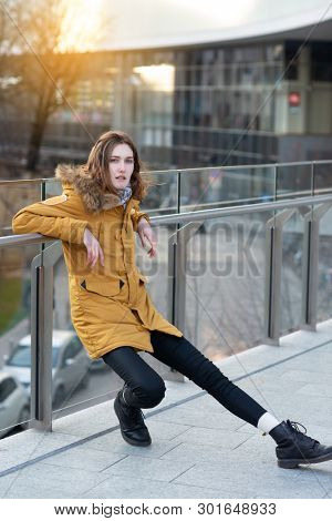 Fashion model posing outdoor. Young blond caucasian woman posing winter outdoo. Beautiful girl, urban portrait.