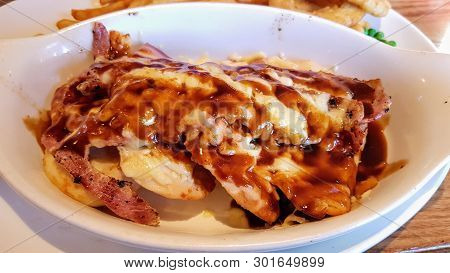 Chicken Breast Topped With Bacon, Cheese And Bbq Sauce.