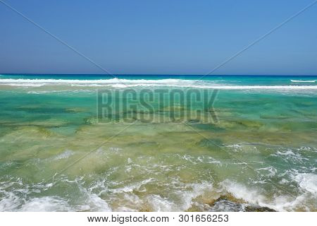Transparent Ocean Water In Corralejo On The Canary Island Fuerteventura, Spain.