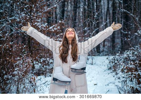 People In Snow. Beauty Winter Girl In Frosty Winter Park. Outdoor Close Up Portrait Of Young Beautif