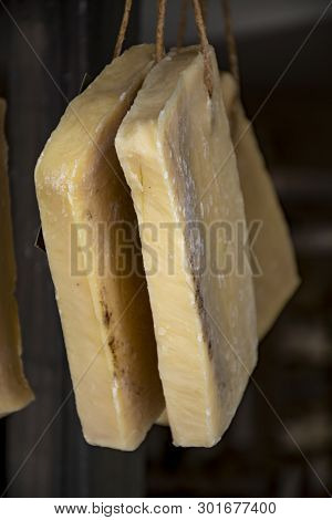 Hand Made From Natural Ingredients And Oils Soap Cutted From Blocks Hanging In Shop Close Up