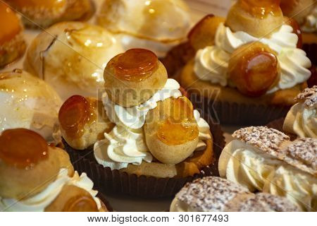 Freshly Baked Stuffed Sweet Sint-honore Pastries In Traditinal French Bakery In Small Village In Pro