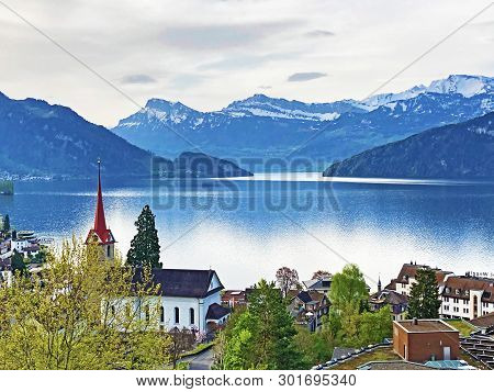 View Of Lake Lucerne Or Vierwaldstaetersee With Vitznau Settlement And Swiss Alps In The Background 